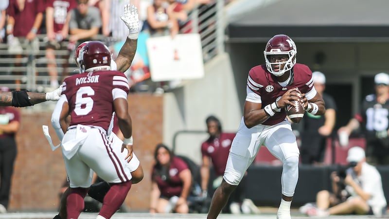 Mississippi State quarterback Kamario Taylor (1) runs out of the pocket against Alabama during...