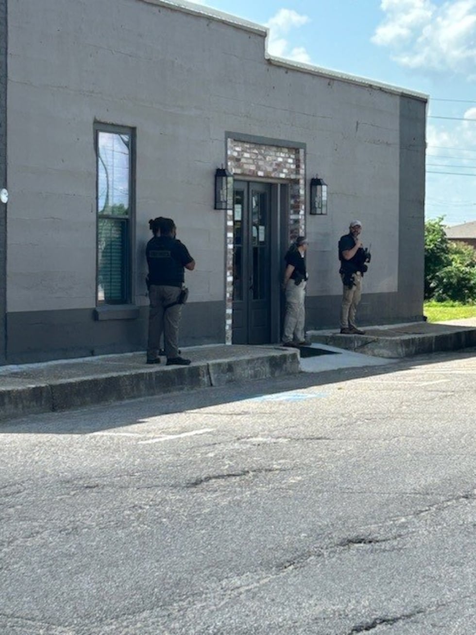 The investigators were seen outside the Town Hall of Rolling Fork and at the funeral home belonging to the mayor ...