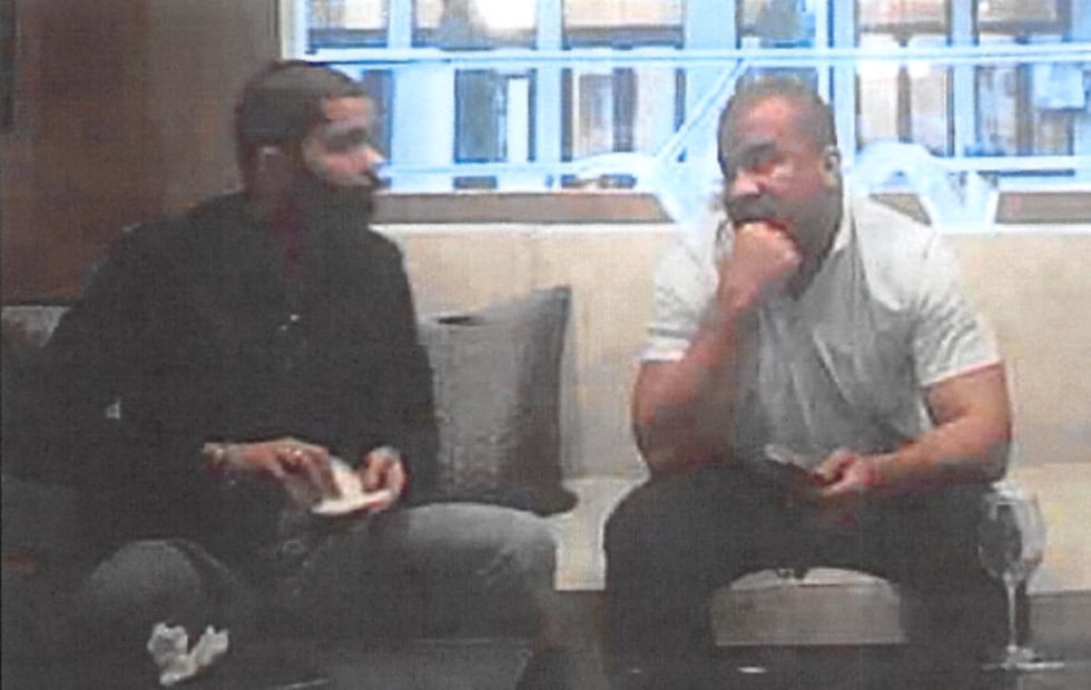 Mayor Chokwe Antar Lumumba folds up paper during a secretly recorded meeting with FBI sources...