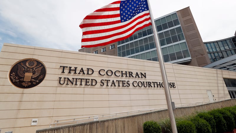 An American flag flies at half-staff outside the Thad Cochran United States Courthouse in...